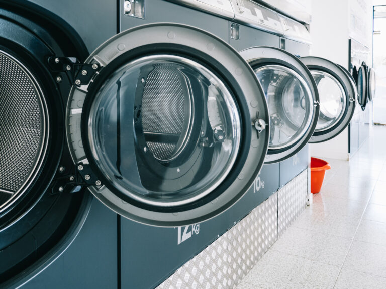 industrial washing machines in a public laundromat
